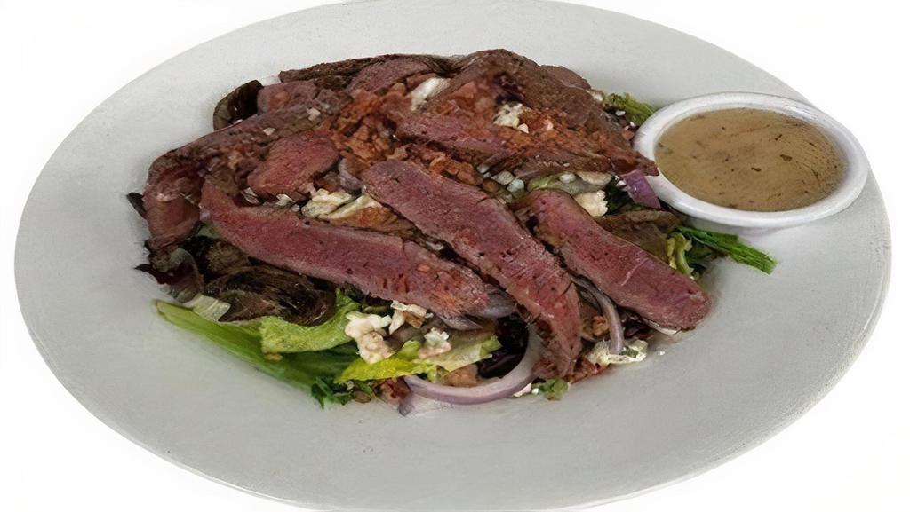 Steak Salad · Top sirloin, mixed greens, red onions, blue cheese crumbles, grilled mushrooms, bacon crumbles,  and bacon vinaigrette dressing.