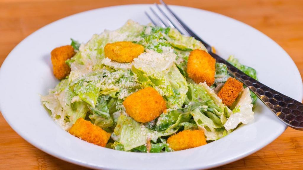 Garden Greens Side Salad · Mixed Greens, cucumber, red onion, tomatoes, cornbread croutons, with a choice of dressing.