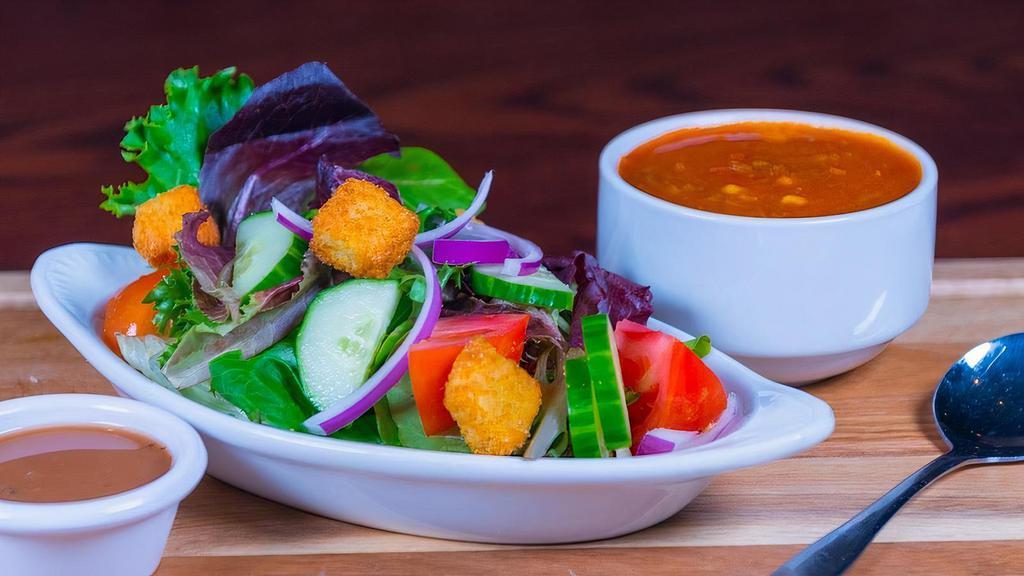 Specialty Soup & Salad · Choice of Garden Greens or Caesar side salad with our cornbread croutons, a cup of one of our specialty soups.