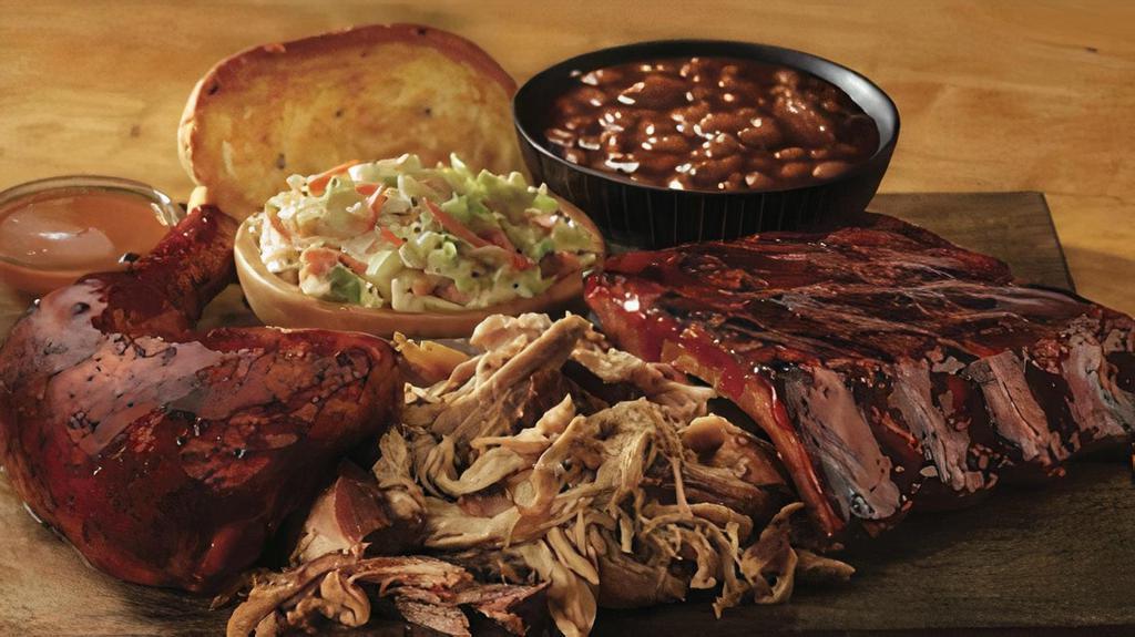 Pitmaster Selection · 1/4 BBQ chicken, 1/3 rack of St. Louis ribs, pulled pork and garlic bread.