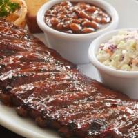 Louis Ribs · Seasoned and hand-rubbed, house-smoked 4 hours, with  sweet and smokey BBQ sauce.