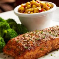 Fire Grilled Salmon · 7 oz Fire Grilled Salmon filet seasoned to perfection with a citrus butter sauce. Served wit...