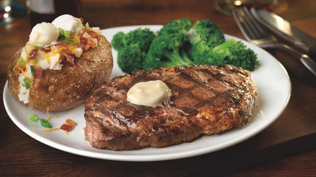 14-Oz Fire-Grilled Ribeye · 14-oz Ribeye,  fire grilled to perfection and served with your choice of sauce. Served with 2 regular sides.