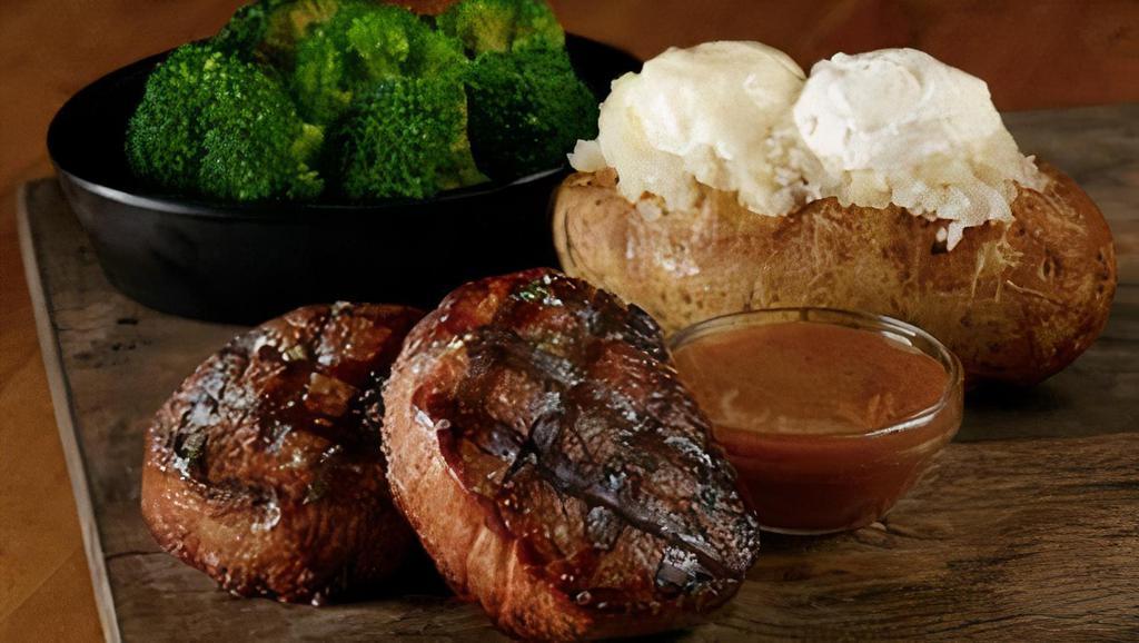 Filet Mignon Medallions · Two 4-oz filet mignon medallions, grilled to perfection with a red wine sauce. Served with 2 regular sides.