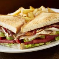 Turkey Club · Slow smoked sliced turkey, bacon, lettuce, tomato with chimichurri mayo. Served with your ch...
