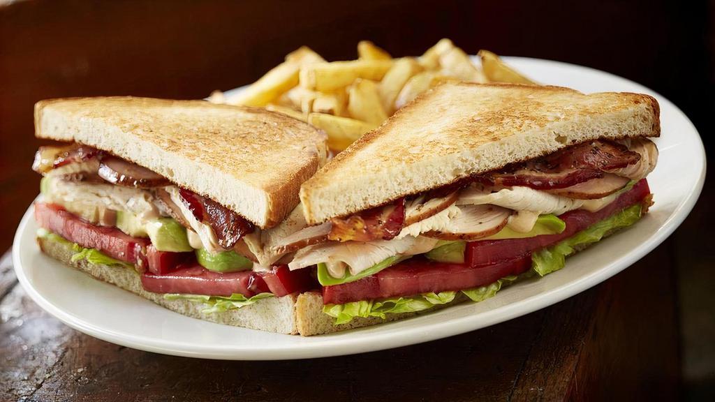 Turkey Club · Slow smoked sliced turkey, bacon, lettuce, tomato with chimichurri mayo. Served with your choice of 1 side.