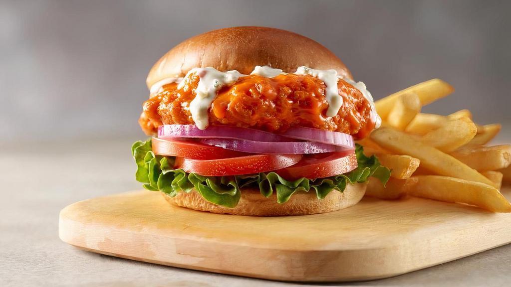 Crispy Buffalo Chicken  · Southern style breaded chicken breast, tossed in buffalo sauce, topped with chunky blue blue cheese dressing and garnished with lettuce, tomato, and onion. Served with your choice of 1 side.