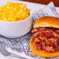Kid'S Pork Sammy · Pulled Pork on a bun served with your choice of 1 regular side and a beverage.