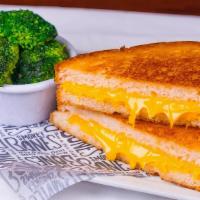 Kid'S Grilled Cheese · Traditional grilled cheese on white bread and American Cheese. Served with your choice of 1 ...