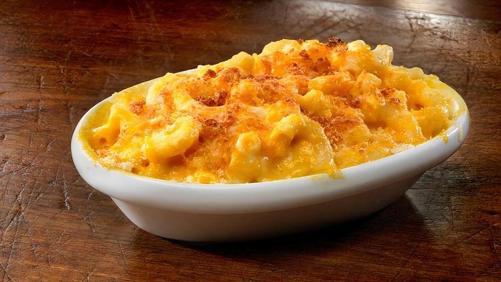 Macaroni & Cheese · House-made Mac & Cheese with cavatappi pasta topped with Cheddar Jack cheese. Upgrade to Family or Large. Family feeds 6-8 people, Large feeds 3-4 people.
