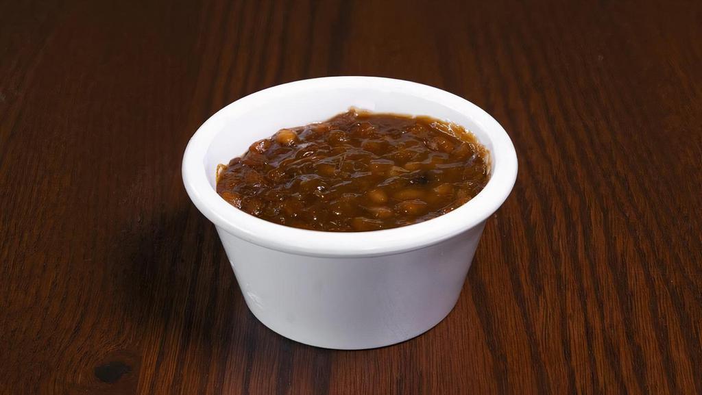 House Made Bbq Baked Beans · Housemade BBQ Baked Beans with Pulled Pork and Brisket. Upgrade to Family or Large. Family feeds 6-8 people, Large feeds 3-4 people,