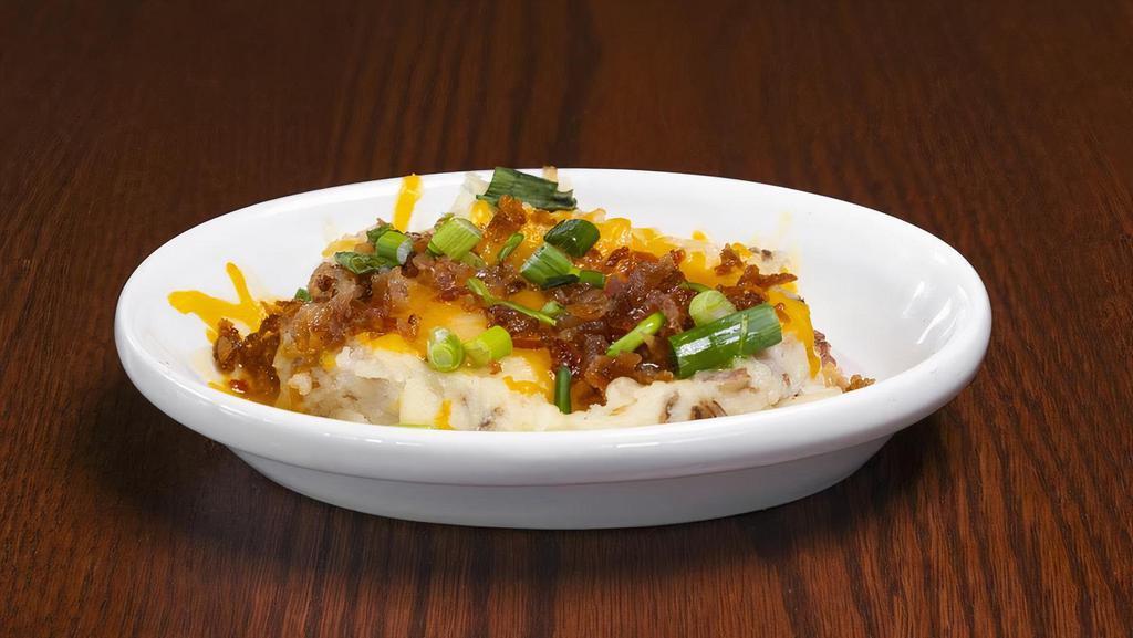 Loaded Mashed Potatoes · Mashed Red Potatoes loaded with Cheddar Jack cheese, bacon pieces and green onions. Upgrade to Family or Large. Family feeds 6-8 people, Large feeds 3-4 people.