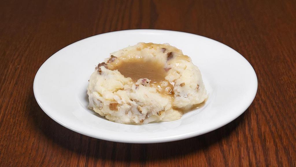 Mashed Potatoes & Brown Gravy · Mashed Red Potatoes served with Brown Gravy. Upgrade to Family or Large. Family feeds 6-8 people, Large feeds 3-4 people.