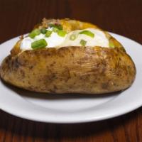 Loaded Baked Potato · Baked Potato loaded with Cheddar Jack cheese, bacon pieces, butter, sour cream and fresh gre...