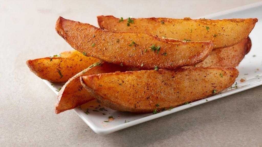 Potato Wedges · Crispy potato wedges tossed with our sweet and smokey dry
rub and topped with fresh parsley.