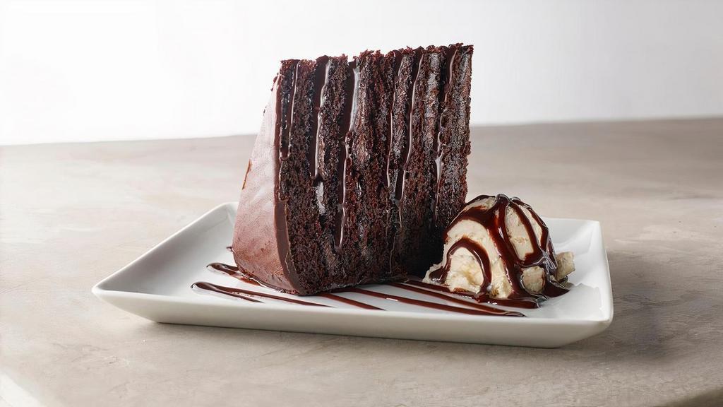 Layered Chocolate Cake · Five layers of chocolate cake, dark fudge, sweet chocolate frosting, vanilla ice cream, a chocolate drizzle.