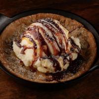 Chocolate Chip Cookie Skillet · House-baked, vanilla ice cream, caramel and chocolate topping.