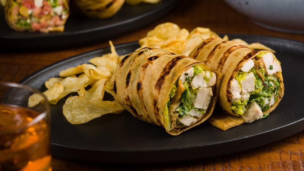 Chicken Caesar Wrap · Grilled chicken,romaine, caesar dressing, grated parmigiana,. rolled in our homemade thin crusted grill bread.