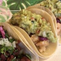 Tacos Al Pastor · Served with cilantro, onions, pineapple, salsa verde and salsa roja on the side.