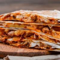 The Buffalo Chicken Quesadilla · Grilled marinated chicken breast topped with buffalo sauce, with cheddar and jack cheese, an...