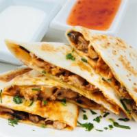 The Chicken And Steak Quesadilla · Grilled marinated chicken breast and marinated steak, with cheddar and jack cheese and serve...