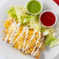 Tacos Dorados · Three chicken corn tacos fried with lettuce, cheese, sour cream and salsa on the side.