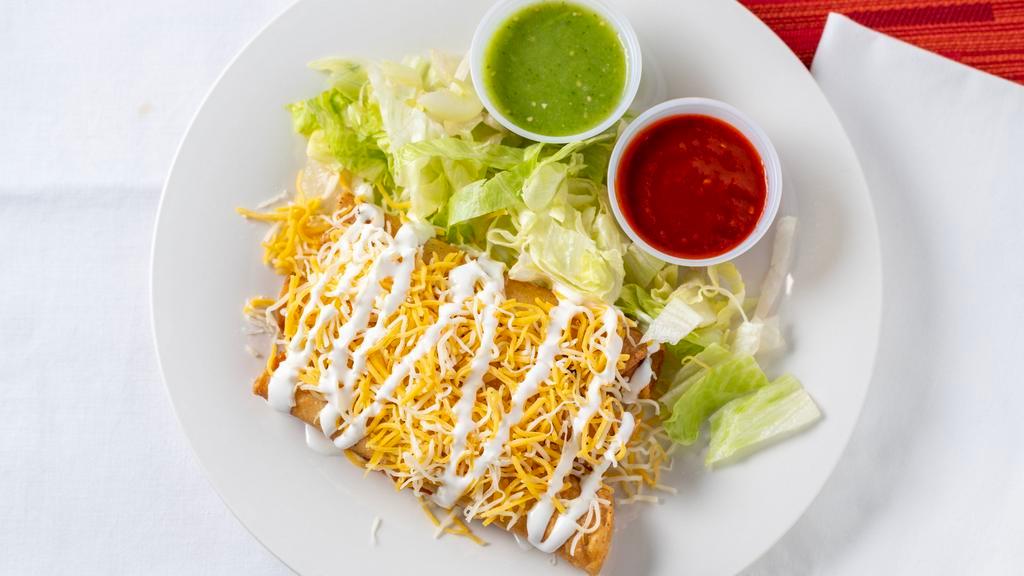 Tacos Dorados · Three chicken corn tacos fried with lettuce, cheese, sour cream and salsa on the side.
