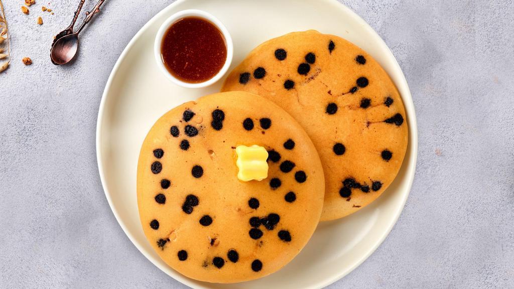 Chocolate Chip Pancakes · Fluffy pancakes cooked with care and love served with chocolate chips, butter and maple syrup. Served in pairs.