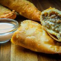 Chopped Cheese Empanada (Beef) · An Empanada transformed from the famous NYC Chopped Cheese Sandwich. Beef, Cheese, Diced Oni...