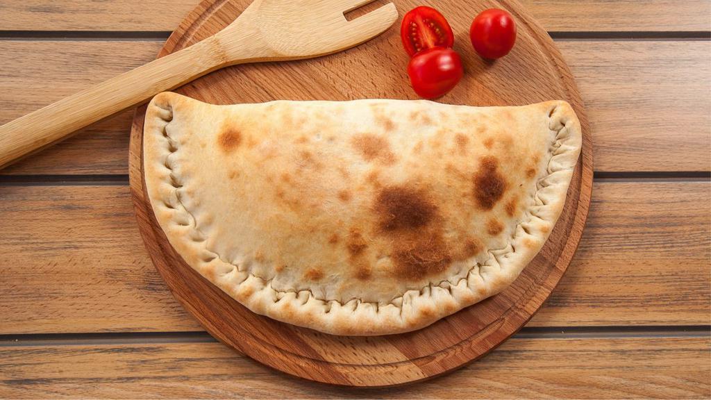 Calzone With Pepperoni, Mushrooms, And Onions · Ricotta and Mozzarella Cheese, topped with pepperoni slices, mushroom, and onions, and stuffed and folded inside Pizza Dough.