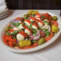 Caprese Salad · Tomato, Mozzarella, Black & Green Olives, Onions & Roasted Red Peppers Dressed w/ Oil & Vine...