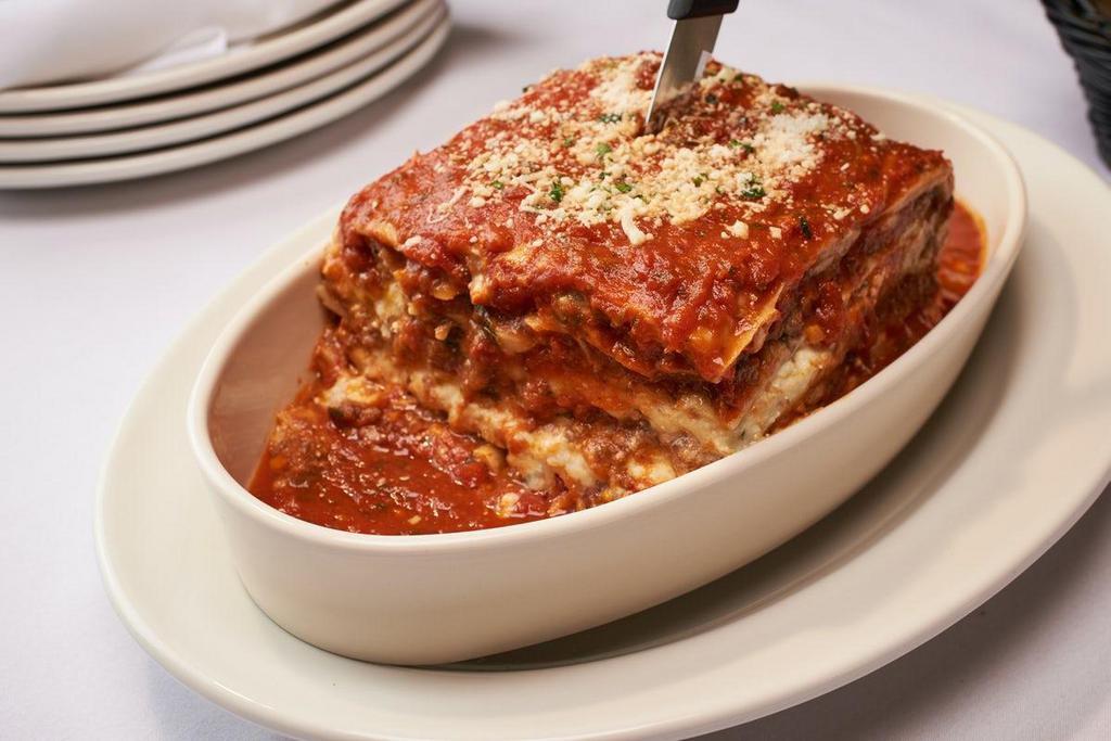 Lasagna · Layers of Ground Beef & Veal Layered with Three Cheeses - Baked & Topped with Our Marinara Sauce - Feeds 2-4