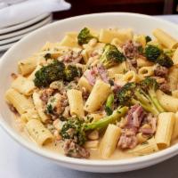 Rigatoni Country Style · Rich & Buttery Sauce Consisting of Pork Sausage, Prosciutto, Chicken Stock, Cannellini Beans...