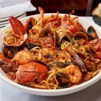 Mixed Seafood · a Variety of Seafood including Lobster, Shrimp, Clams, Mussels & Calamari & Served with Eith...