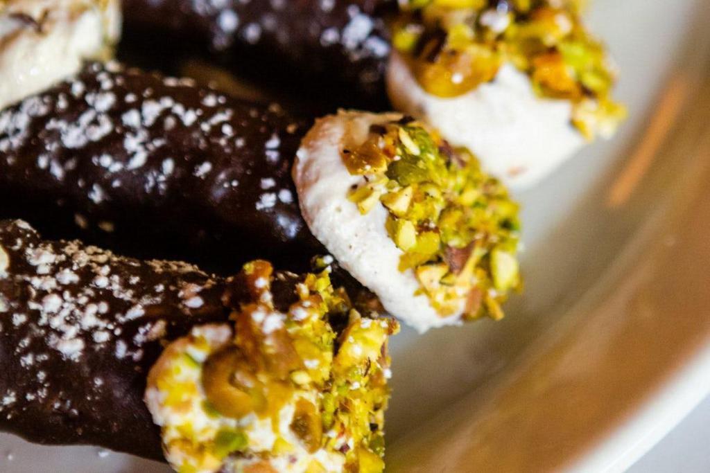 Chocolate Cannoli (3Pc) · Small Chocolate Covered Cannoli Shells Ricotta Filling with Candied Fruit, Chocolate Chips, Pistachios