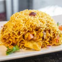 Bhel Puri · crispy rice puffs tossed with chopped onion, tomatoes, mint and tamarind chutney, sprinkled ...