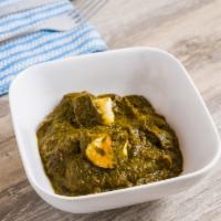 Saag Paneer · mustard greens & spinach cooked together with cottage cheese cubes, flavored with ginger, on...