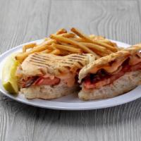 Culture Club · Our turkey club panini with turkey, bacon, Swiss cheese and tomato, grilled to a golden brow...