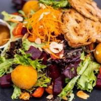 Crispy Goat Cheese And Beet Salad · Breaded Goat Cheese, Roasted Beets, Leafy Greens, Almonds, Balsamic Vinaigrette, Cranberry C...