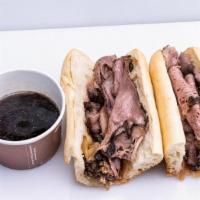 Wagyu French Dip With Au Jus · Snake River Farms American Wagyu Beef, Caramelized Onions, on an Organic Rustic Baguette, wi...