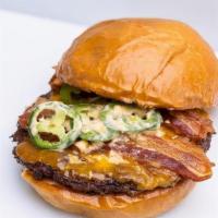 Bacon Jalapeno Cheddar Burger · Angus Steak Burger Patty, Bacon, Fresh Jalapeño, Creamy Dijon, and Cheddar on an Artisan Bun...
