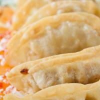 Gyoza Dumplings · 6 pieces. Fried or steamed.
