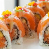Golden Eye · Crunchy spicy salmon and mango topped with salmon, jalapeño, red and yuzu caviar with miso s...
