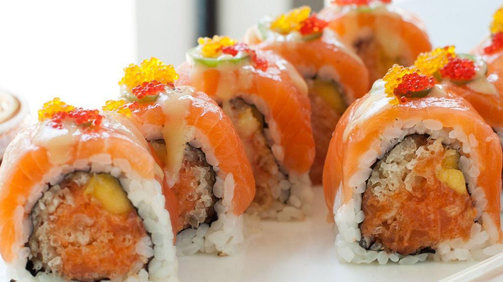 Golden Eye · Crunchy spicy salmon and mango topped with salmon, jalapeño, red and yuzu caviar with miso sauce.