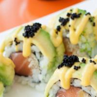 Ridgewood Roll · Salmon, fresh pineapple, and crunch topped with avocado and black caviar with mango sauce.