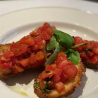 Bruschetta · Toasted bread with fresh tomatoes, basil, extra virgin olive oil & touch of garlic.