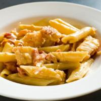 Penne With Lobster Tomato Cream (Appetizer) · Lobster in a brandy tomato cream sauce.