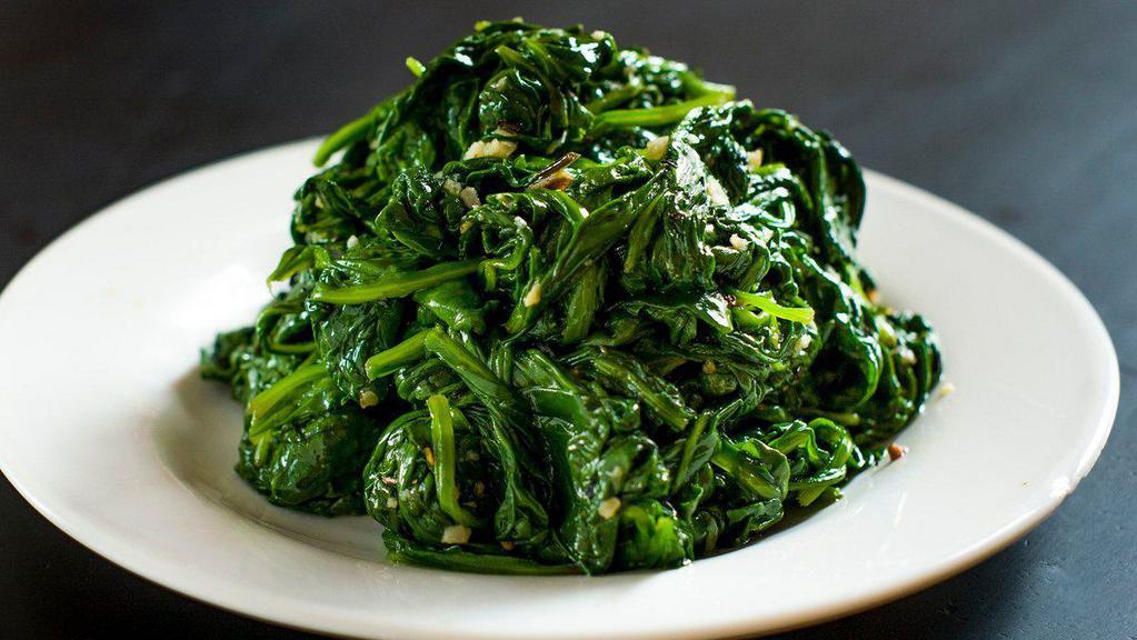 Spinach & Garlic · Side portion of sauteed spinach and garlic with olive oil.