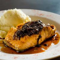 Salmon Moroccan · Grilled and topped with a spiced compound butter, served with mashed potatoes.