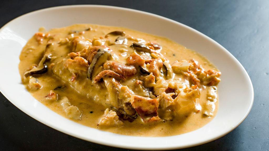 Sole With Lobster & Tomato Cream · Sautéed in a brandy tomato cream sauce with lobster and mushrooms.